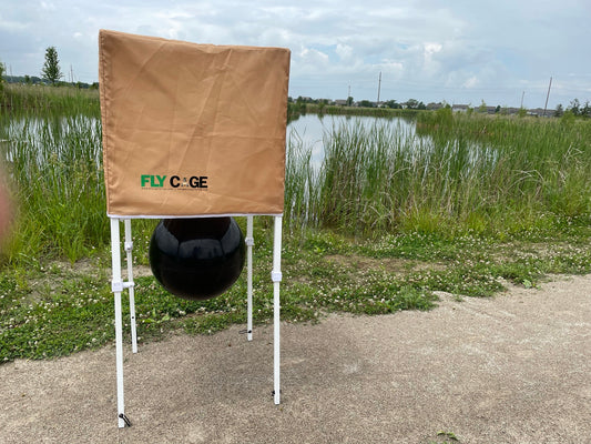 Fly Cage horse fly trap set up outdoors near pond and walking trail